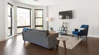 a living room with a couch and two chairs at Landing Spectacular 2BD Gym in Cleveland