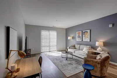 a living room with a couch and a table at Landing Stylish 1BD Yoga Studio Gym in Grove City
