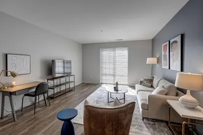 a living room with a couch and a table at Landing Stylish 1BD Yoga Studio Gym in Grove City