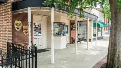 a building on a street with a black gate at Landing Stylish 1BD Yoga Studio Gym in Grove City