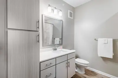 a white bathroom with a sink and a mirror at Landing Chic 1BD Yoga Studio Gym in Florence