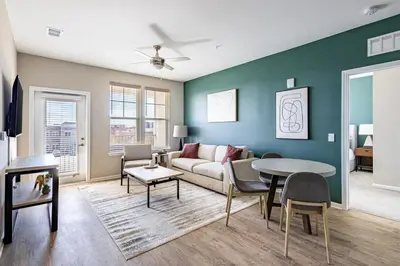 a living room with a couch and a table at Landing Chic 1BD Yoga Studio Gym in Florence