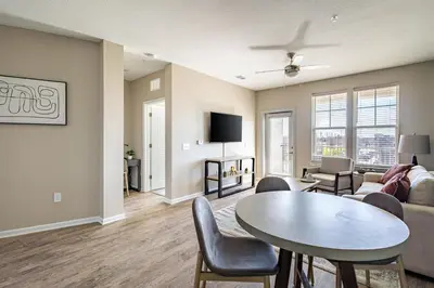 a living room with a table and a couch at Landing Chic 1BD Yoga Studio Gym in Florence