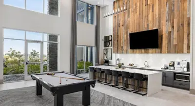 a living room with a pool table and a tv at Landing Apartment - Tapestry Ridge in Fort Wright