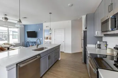 a kitchen with a sink and a counter top at Landing Stunning 2BD in Manhattan Harbour in Cincinnati