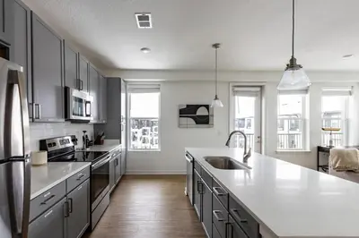 a kitchen with a sink and a counter top at Landing Stunning 2BD in Manhattan Harbour in Cincinnati