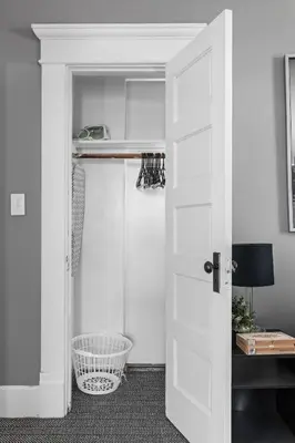 a closet with a white door and a shelf at Stylish New Castle Escape with Garage and by Parks-Family Friendly in New Castle