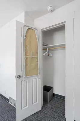 a white door in a room with a closet at New Castle Getaway with Fireplace Garage & Near Attractions-Family Friendly in New Castle