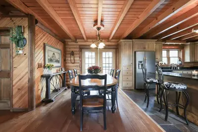 a dining room with a wooden ceiling and a table and chairs at Family-Favorite Cabin with Private Seasonal Pool and Movie Theater in Celina