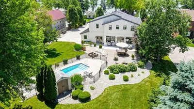an aerial view of a house with a swimming pool at Spacious Family Gem Near Lake & State Park with Pool and Hot Tub in Celina