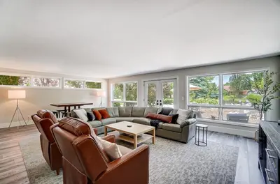 a living room with a couch and a table at Spacious Family Gem Near Lake & State Park with Pool and Hot Tub in Celina