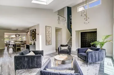 a living room with couches and a table at Spacious Family Gem Near Lake & State Park with Pool and Hot Tub in Celina