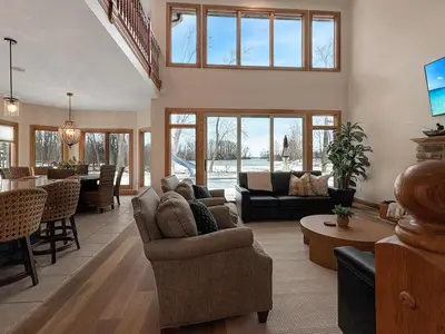 a living room with a couch and a table at Grand Lake Getaway with Pool, Boat Dock - Sleeps 22 in Celina