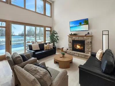 a living room with couches and a fireplace at Grand Lake Getaway with Pool, Boat Dock - Sleeps 22 in Celina