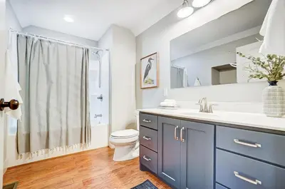 a bathroom with a sink and a toilet and a shower at Golf Course Home with Pool and Hot Tub Near Lake and State Park in Celina