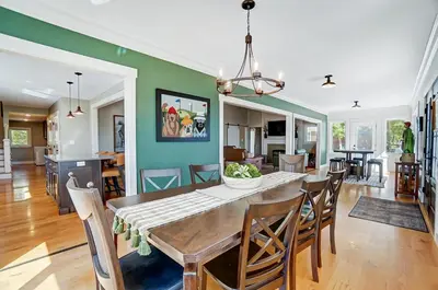 a dining room and living room with a table and chairs at Golf Course Home with Pool and Hot Tub Near Lake and State Park in Celina