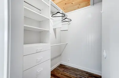 a white walk in closet with white cabinets at Golf Course Home with Pool and Hot Tub Near Lake and State Park in Celina