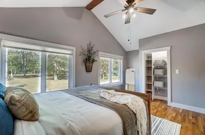 a bedroom with a bed and a ceiling fan at Golf Course Home with Pool and Hot Tub Near Lake and State Park in Celina