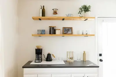 a kitchen with a counter with a coffee maker on it at 