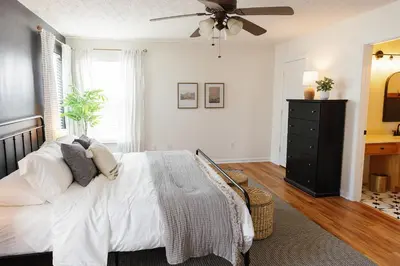 a bedroom with a bed and a ceiling fan at 