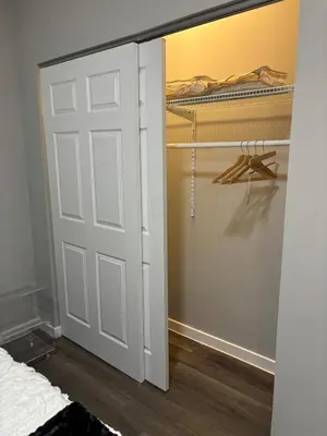 a closet with a white door in a bedroom at Brand new listing Aimi Luxury Retreat in Dayton