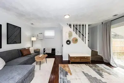 a living room with a couch and a table at The Beautiful Jenkins Getaway in Columbus