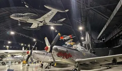 a plane is hanging in a hangar with other planes at Modern Retreat Near DAY Airport & Metropark in Vandalia