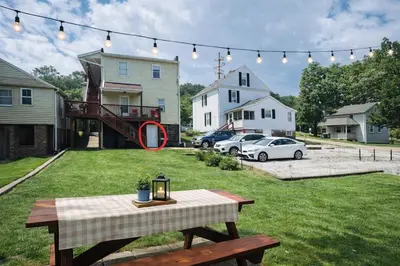 a picnic table in the yard of a house at Brand new first floor studio in quiet neighborhood in Akron