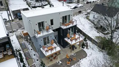 an aerial view of a house with snow on the ground at trekløveren in Covington