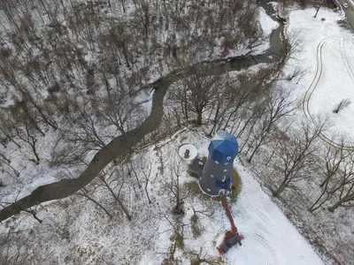 an overhead view of a fire hydrant in the snow at The Grand Landmark 5-Story Windmill Retreat in Lorain