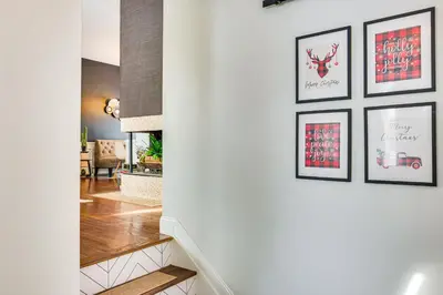 a hallway with three framed pictures on a wall at Close to BW Campus and Univ Hospitals Berea Home in Berea