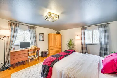 a bedroom with a bed and a desk with a computer at Close to BW Campus and Univ Hospitals Berea Home in Berea