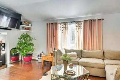 a living room with a couch and a table at Close to BW Campus and Univ Hospitals Berea Home in Berea