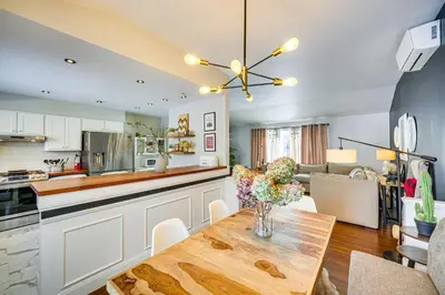 a kitchen and living room with a wooden table at Close to BW Campus and Univ Hospitals Berea Home in Berea