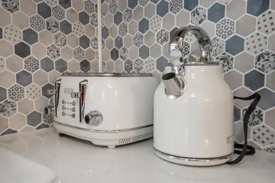 two toasters sitting on a counter in a kitchen at Charming Renovated Home in Lakewood in Lakewood