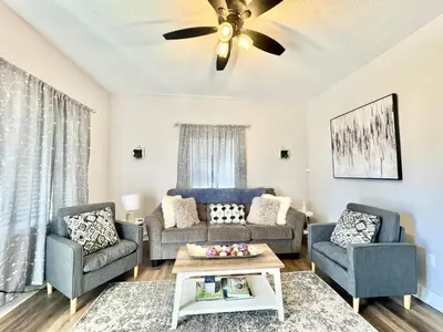 a living room with two couches and a ceiling fan at Newly Remodeled 2 Bedroom Home in Shelbyville Family Friendly in Shelbyville