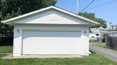 a white garage door in the front of a house at Newly Remodeled 2 Bedroom Home in Shelbyville Family Friendly in Shelbyville