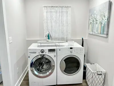 a washer and dryer in a white laundry room at Newly Remodeled 2 Bedroom Home in Shelbyville Family Friendly in Shelbyville