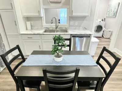 a kitchen with a table with a potted plant on it at Newly Remodeled 2 Bedroom Home in Shelbyville Family Friendly in Shelbyville