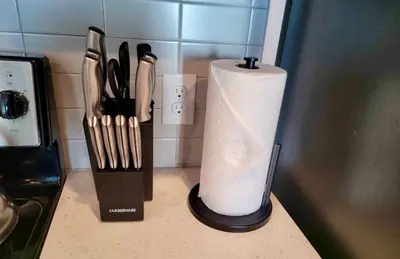 a roll of paper towels on a counter with knives at Cincinnati Downtown Oasis in Cincinnati