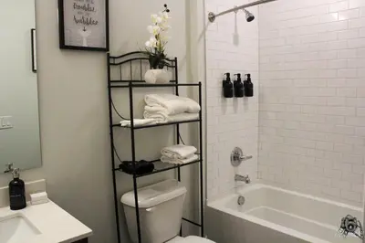 a bathroom with a toilet and a shower and a sink at Cincinnati Downtown Oasis in Cincinnati