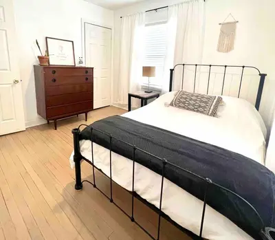 a bedroom with a bed and a dresser and a bed sidx sidx sidx sidx at Peaceful Cozy 2BR OASIS in Dayton
