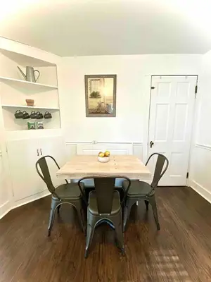 a dining room with a table and four chairs at Peaceful Cozy 2BR OASIS in Dayton