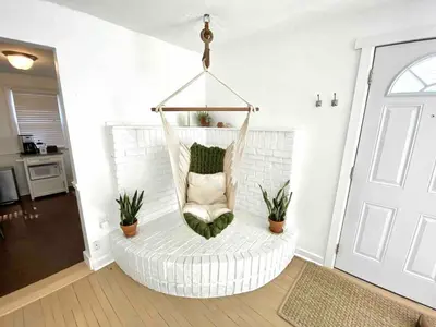 a hanging hammock chair in a living room at Peaceful Cozy 2BR OASIS in Dayton