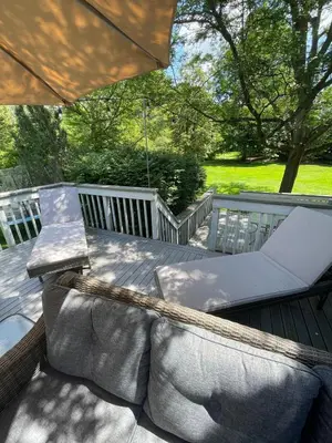a hammock on a deck with an umbrella at Quiet Guest Space with Hot Tub, Laundry, and Gym in Chagrin Falls