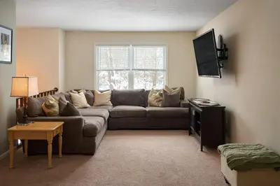 a living room with a couch and a window at Quiet Guest Space with Hot Tub, Laundry, and Gym in Chagrin Falls