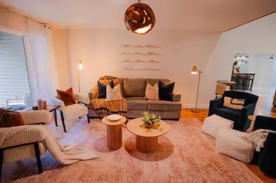 a living room with a couch and a table at The 312 House| A Boho Retreat| Hocking Hills in Logan