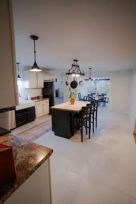 a kitchen and dining room with a table and chairs at The 312 House| A Boho Retreat| Hocking Hills in Logan