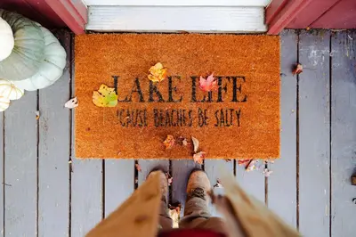 a person standing on the floor with their feet on a sign at Waterfront A- Frame with Dock, Canoe + Kayaks in Rockbridge
