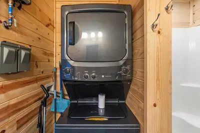 a kitchen in a tiny house with a microwave at The Hummingbird - Mountaintop Cabin with Hot Tub in Stanton
